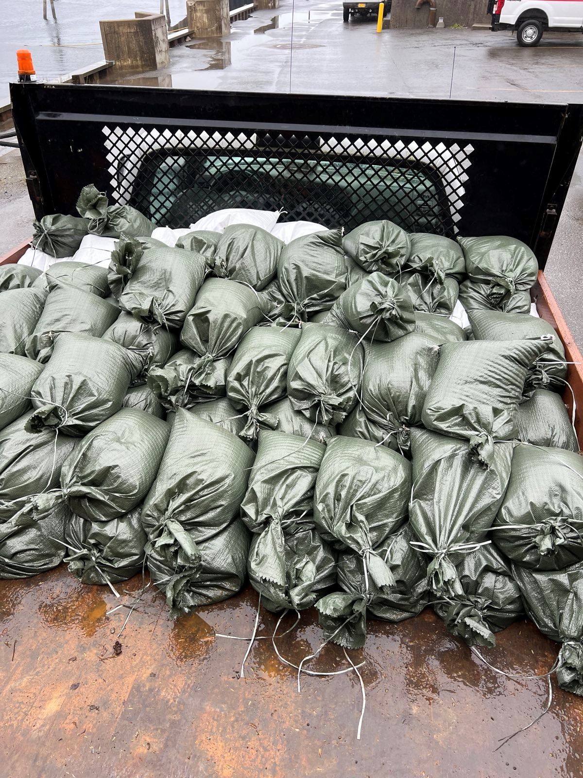 Sandbagging to divert the flow of water