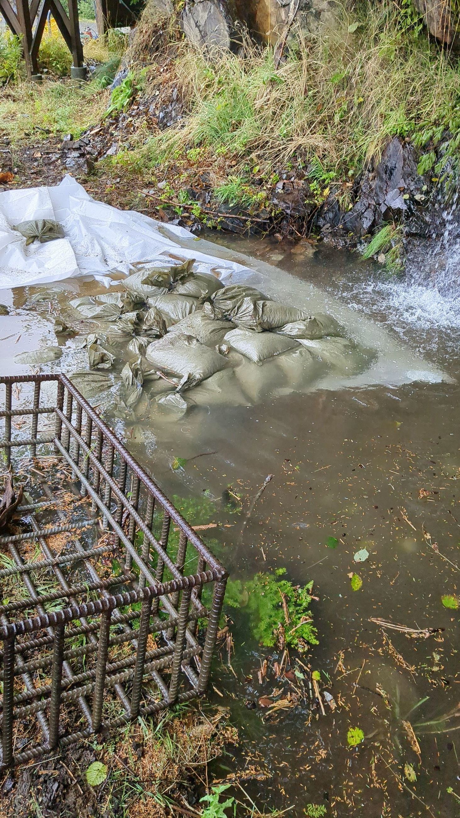 Sandbagging to divert the flow of water